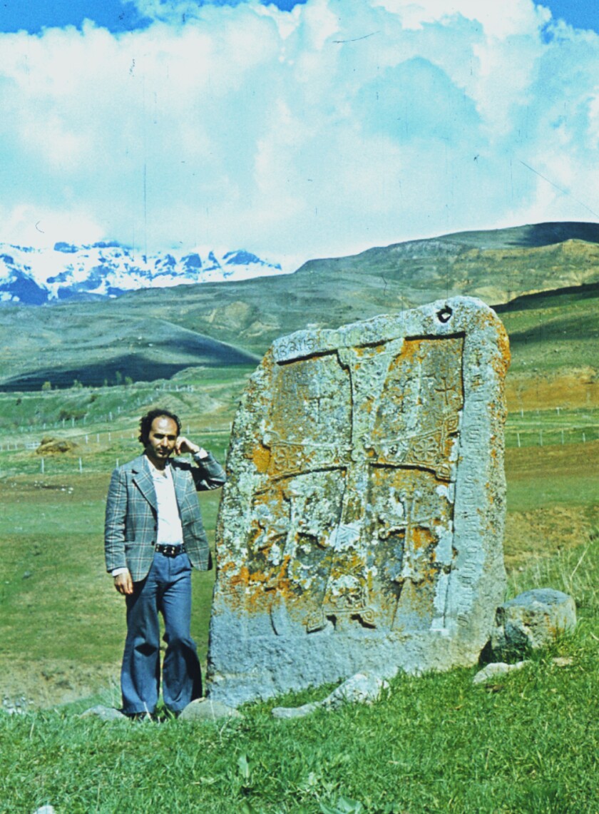 Argam Ayvazyan, a researcher who documented the medieval Armenian monuments of Nakhichevan, pictured by a khachkar.
