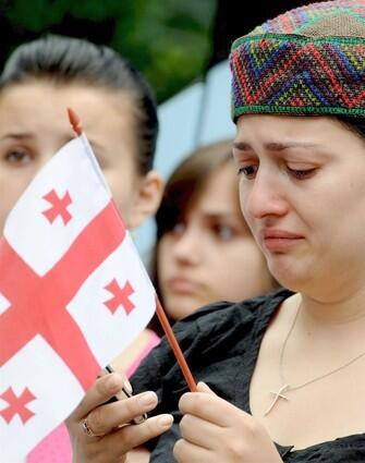 A Georgian woman weeps during a rally outside the Russia embassy in Prague, Czech Republic.