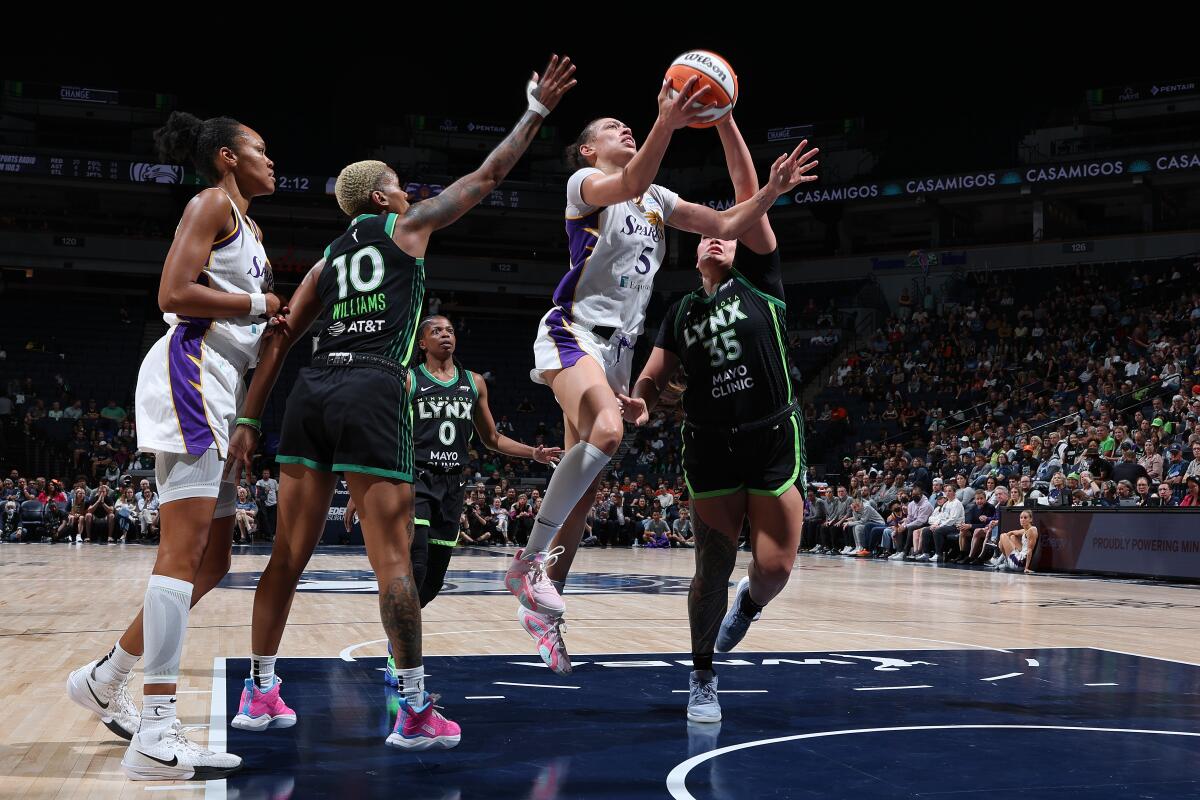 Sparks forward Dearica Hamby drives to the basket during a 68-50 win over the Minnesota Lynx.