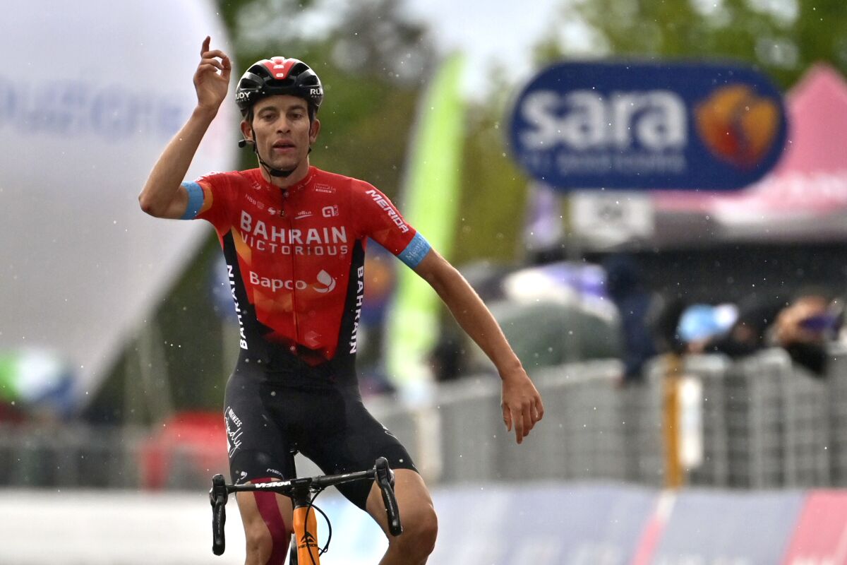 Switzerland's Gino Mader celebrates after winning the sixth stage of the Giro d'Italia cycling race, from Grotte di Frasassi to Ascoli Piceno Thursday, May 13, 2021. (Massimo Paolone/LaPresse via AP)