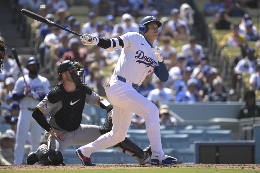 Los Angeles Dodgers' Shohei Ohtani hits a triple in the sixth inning during a baseball game against the Pittsburgh Pirates Sunday, Aug. 11, 2024, in Los Angeles. (AP Photo/Jayne-Kamin-Oncea)