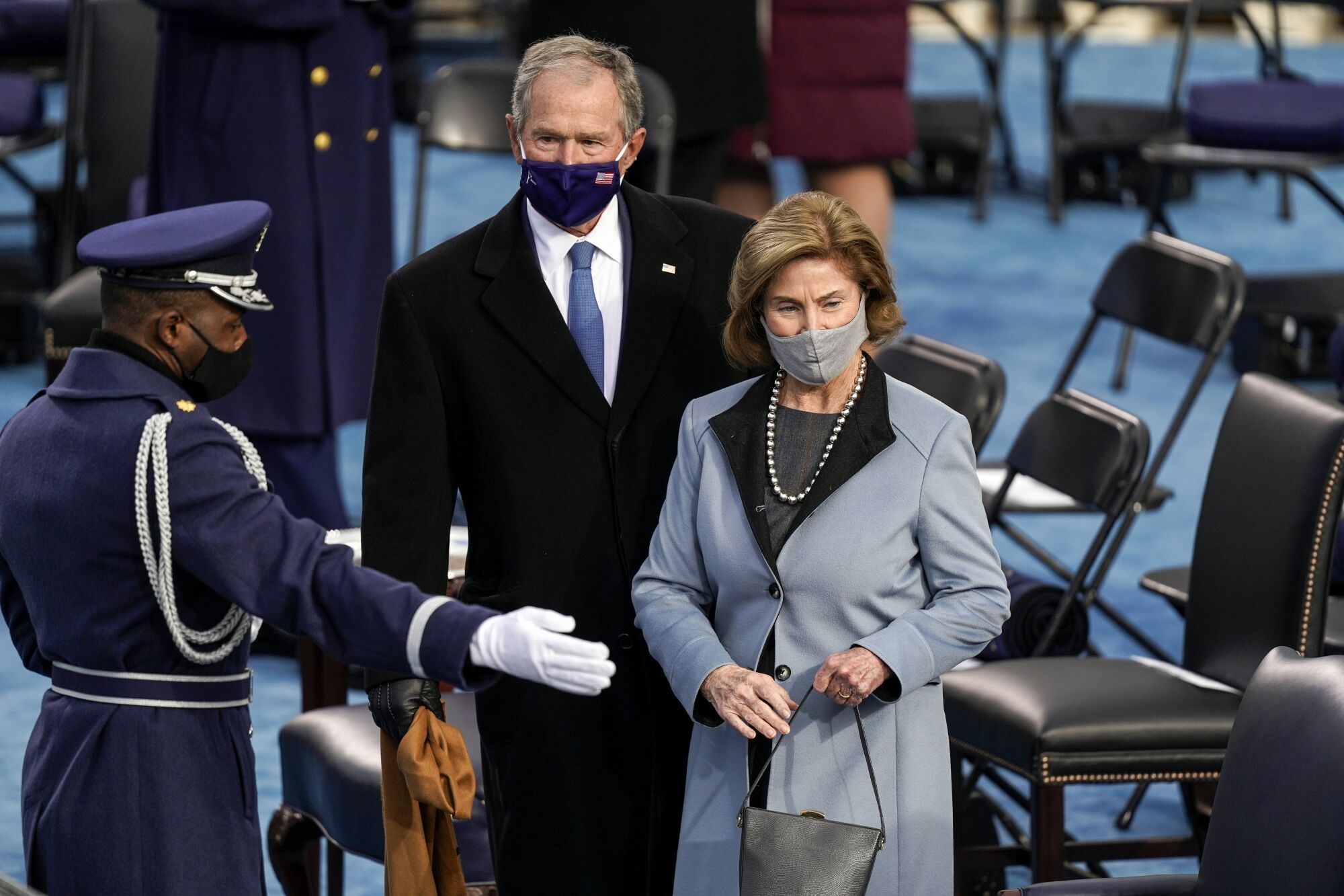 Former President George W. Bush and Laura Bush arrive at the inauguration of President Biden.