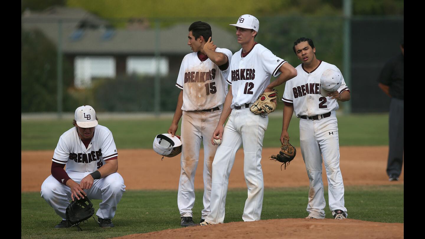 Laguna's Sawyer Chesley, Eric Silva, Jack Loechner, and Jared Angus ponder their next move down 3-1 during first round of the CIF Southern Section Division 2 baseball playoffs against Tahquitz of Hemet on Thusrday.