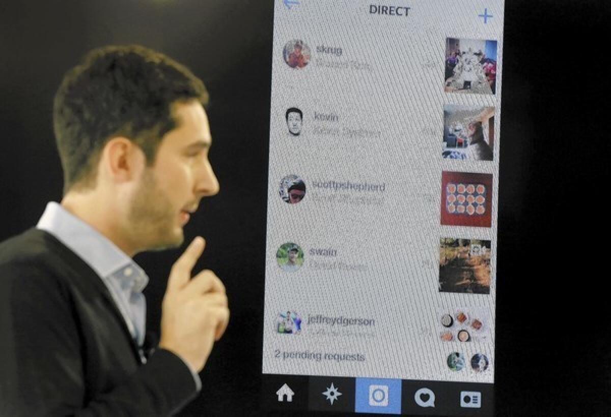 Instagram co-founder Kevin Systrom introduces Instagram Direct at a news conference in New York.