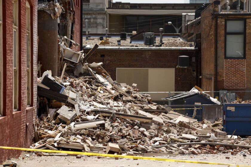 Rubble lies in a pile outside The Davenport on Main Street in Davenport, Iowa, on Monday, May 29, 2023. A section of the six-story downtown apartment building collapsed Sunday. (Nikos Frazier/Quad City Times via AP)