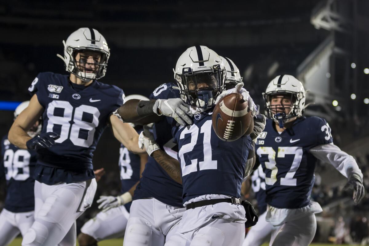 Penn State's Tyler Rudolph celebrates with his teammates against Rutgers on Nov. 30 at Beaver Stadium.