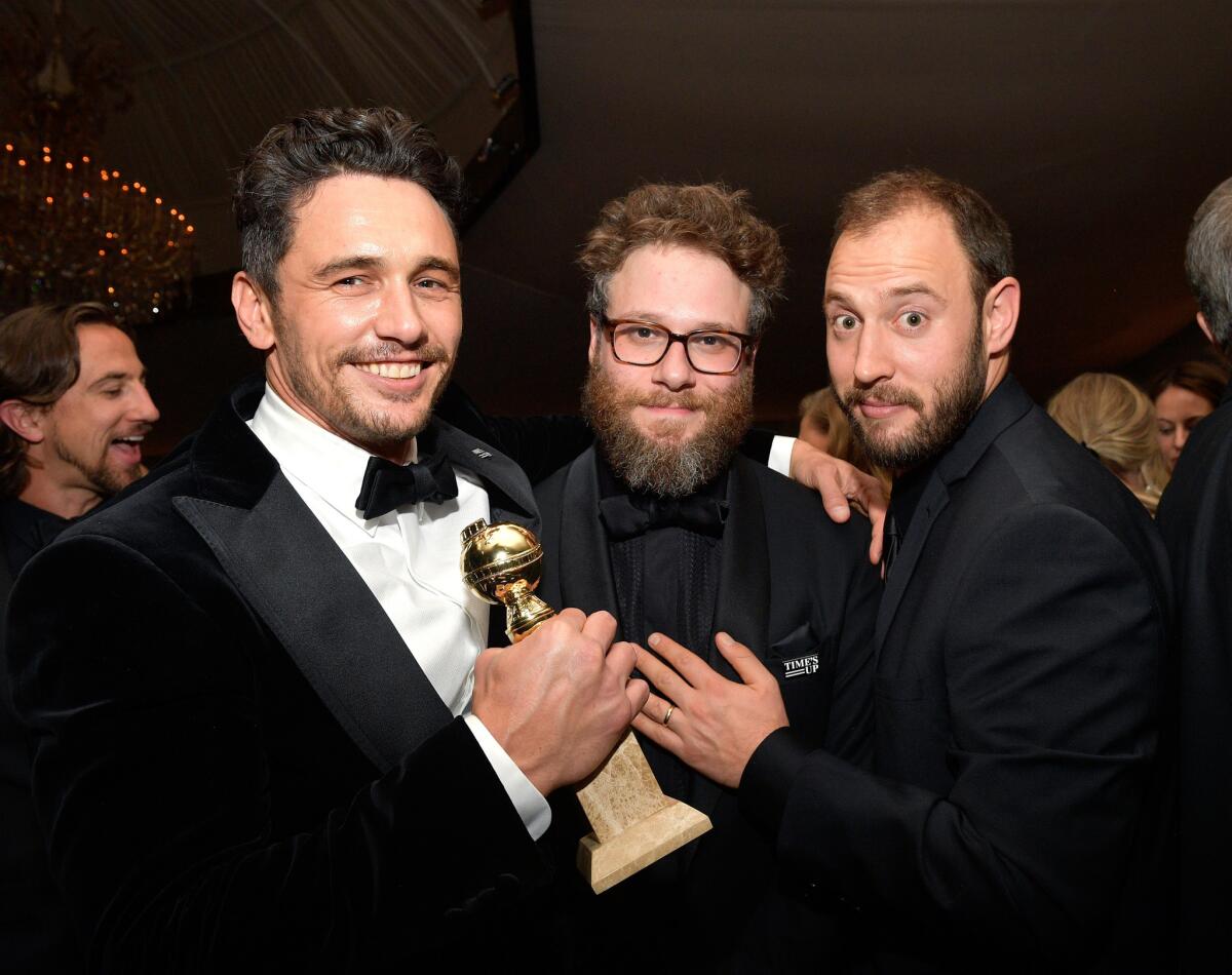 From left, Golden Globes winner James Franco, Seth Rogen and screenwriter Evan Goldberg attend the InStyle and Warner Bros. after-party at the Beverly Hilton on Sunday.