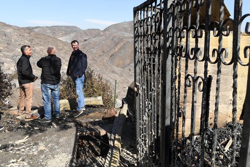 BRENTWOOD, CALIFORNIA OCTOBER 29, 2019-From left, L.A. Mayor Eric Garcetti, L.A. City Councilman Mike Bonin and California Governor Gavin Newsom view a burned and home along Tigertail Road in Brentwood Tuesday. (Wally Skalij/Los Angeles Times)