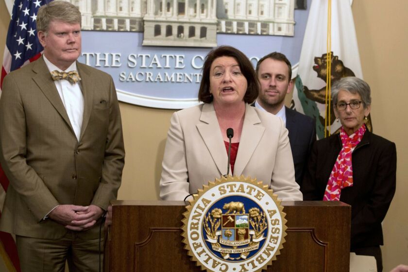 Assembly Speaker Toni Atkins, D-San Diego, discusses the bill that she, Assembly members Mark Stone, D-Scotts Valley, left, and Marc Levine, D-San Rafael, second from right, coauthored to require lobbyists to report their interactions with members of the California Coastal Commission, during a news conference, Tuesday, Feb. 16, 2016, in Sacramento, Calif. At right is Sen. Hannah-Beth Jackson, D-Santa Barbara. (AP Photo/Rich Pedroncelli)