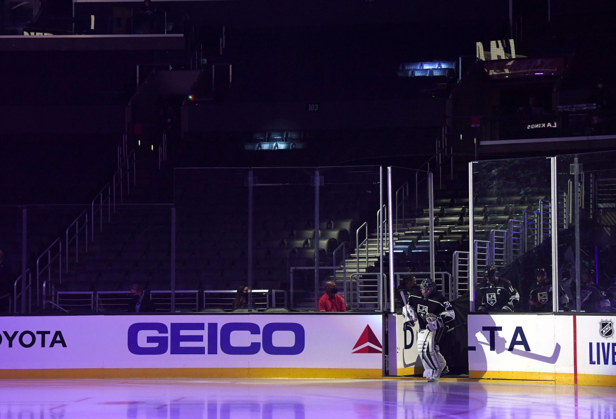 Kings goaltender Jonathan Quick skates onto the ice at an empty Staples Center.
