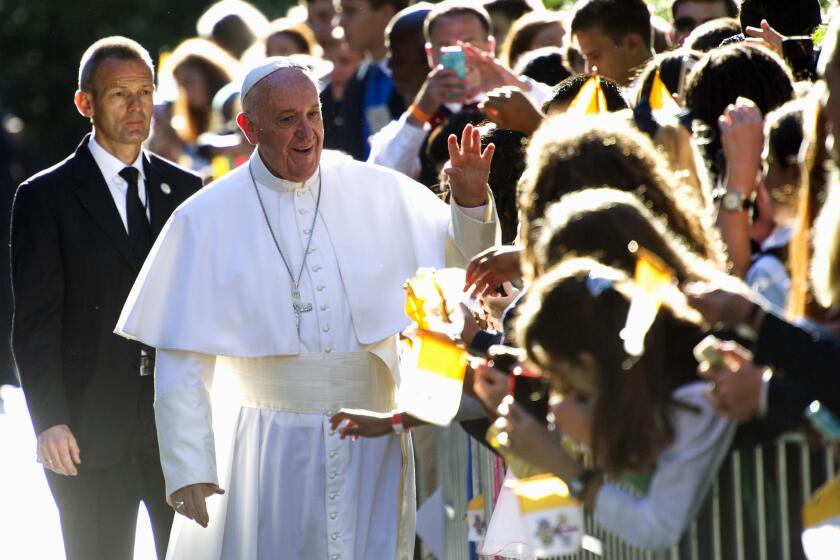Pope Francis greets schoolchildren before leaving the Apostolic Nunciature, the Vatican's diplomatic mission in the heart of Washington.