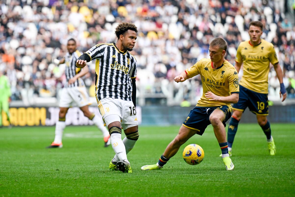 Weston McKennie of Juventus is challenged by Genoa's Albert Gudmundsso during a Serie A match on March 17.