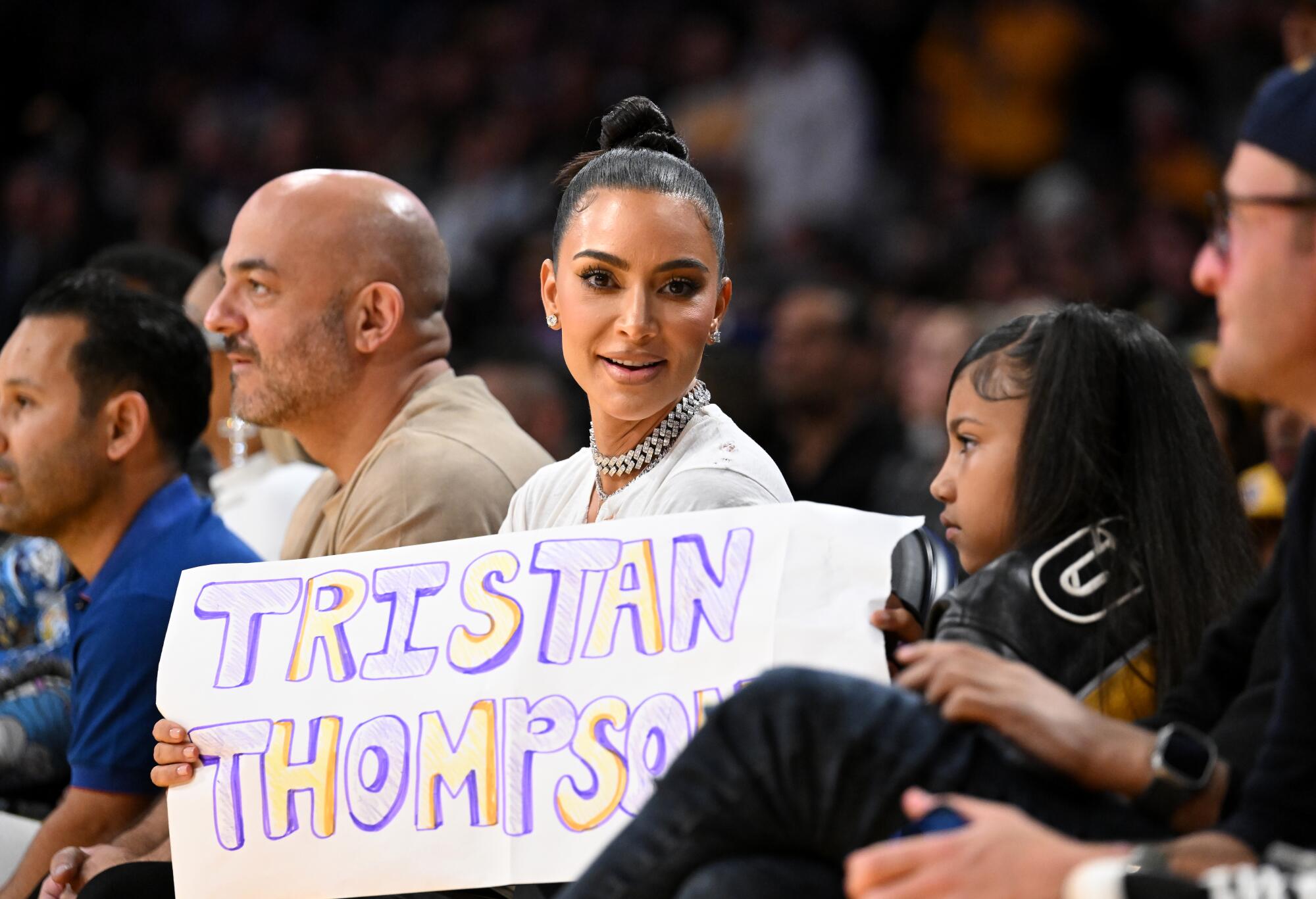 Kim Kardashian attends a playoff game with daughter North West at Crypto.com Arena.