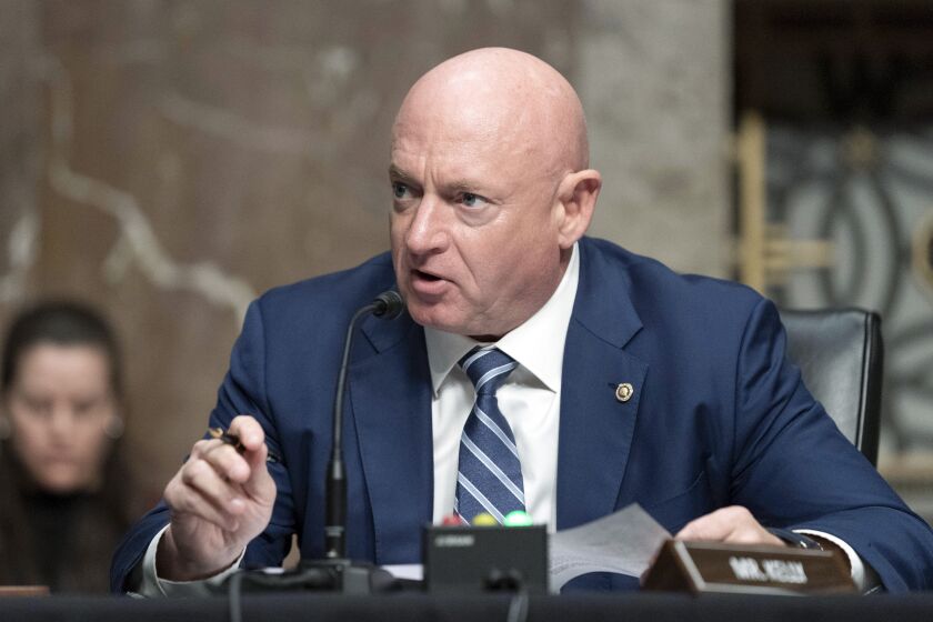 FILE - Sen. Mark Kelly, D-Ariz., speaks during a hearing of the Senate Armed Services Committee, on Capitol Hill, in Washington, March 24, 2022. A year ago, Arizona’s Democratic Secretary of State Katie Hobbs was all over cable news, building a national profile as a defender of democracy and raking in cash for her campaign for governor. Democratic Sen. Mark Kelly, newly elected to finish John McCain’s last term and running for re-election, looked to be among the most vulnerable members of the Senate. Fortunes appear to have flipped for the two Democrats. (AP Photo/Jose Luis Magana, File)