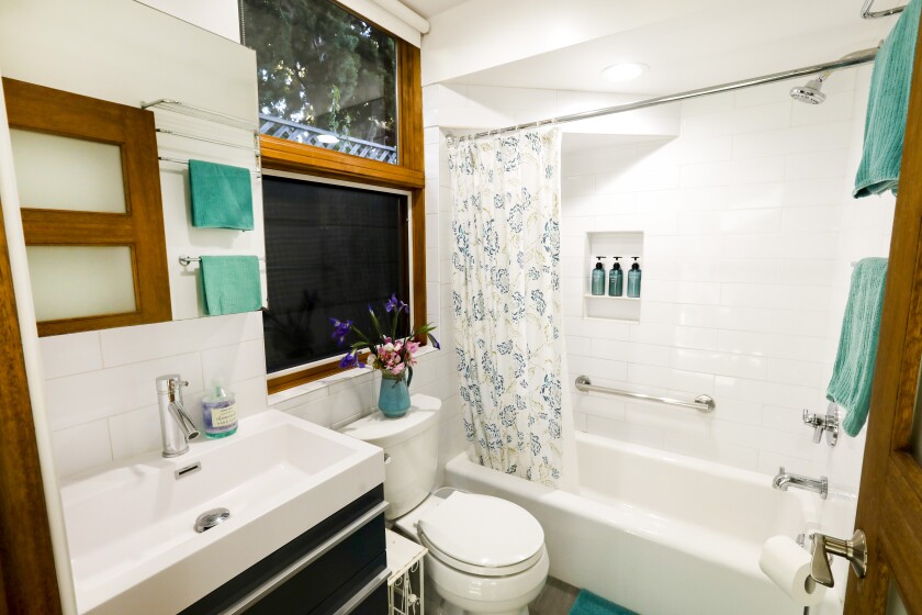 A bathroom sink, toilet and shower