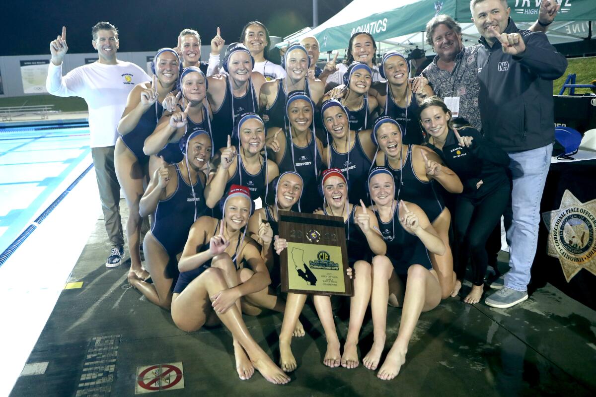 Newport Harbor's girls' water polo team celebrates its CIF Southern Section Open Division Championship.  