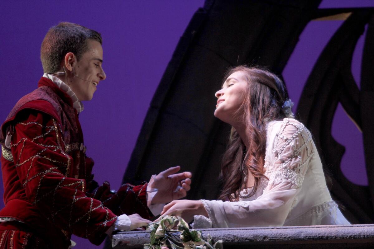 Theatrical Education Group's Shakespearience actors Kevin DeSimone plays Romeo while Katie Robbins plays Juliet from Shakespeare's Romeo and Juliet for a full house of students at the Alex Theater in Glendale on Tuesday, Jan. 20, 2015.