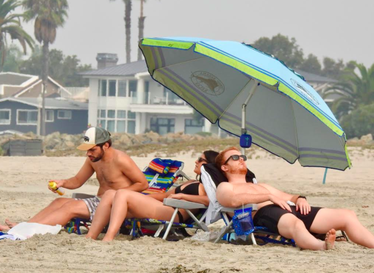 Smoke from the wildfires continued to mute the sun on Sunday at Coronado