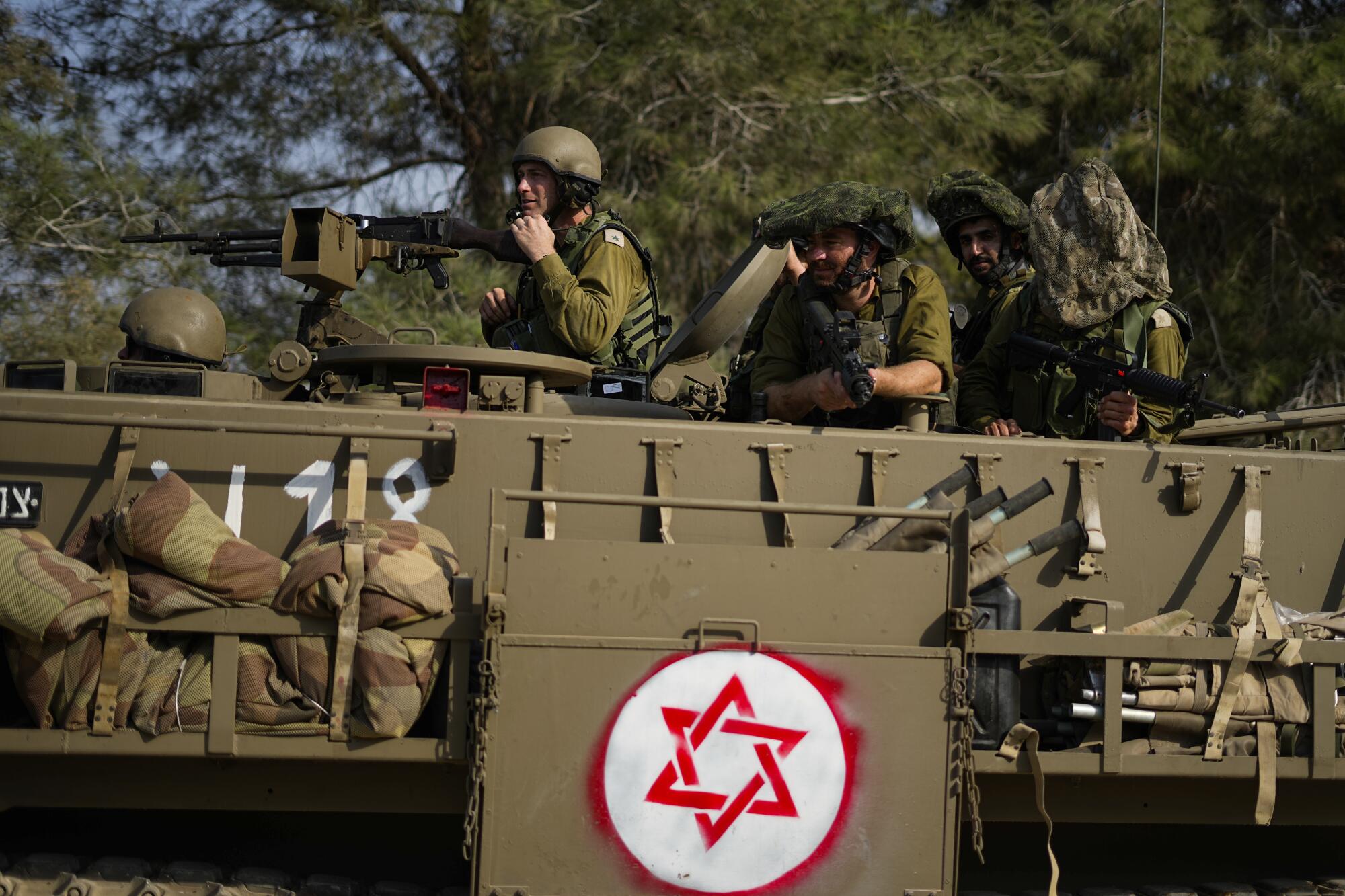 Israeli soldiers in an armored personnel carrier