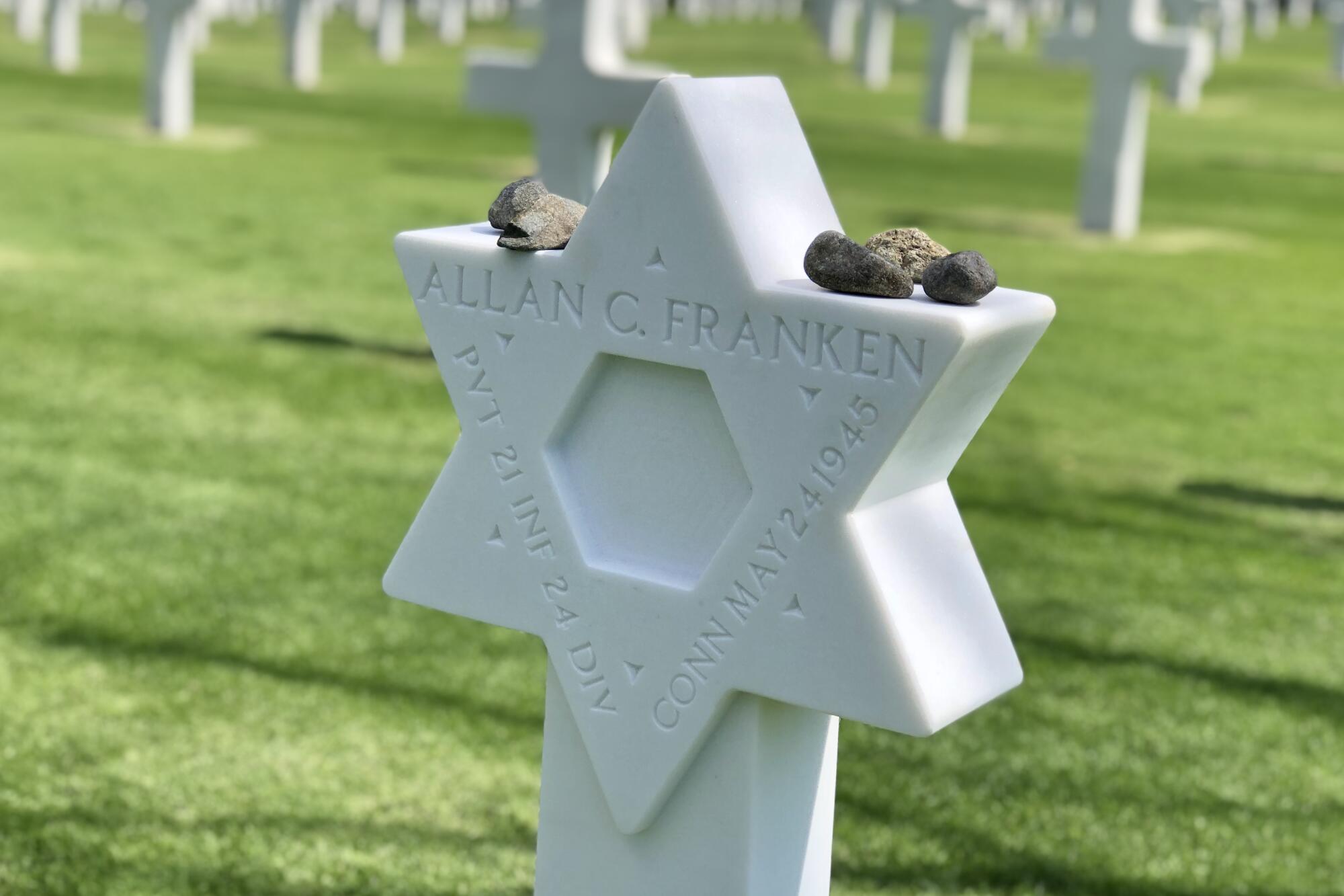 The gravestone of Pvt. Allan C. Franken, a Jewish soldier killed in the Philippines in the final months of World War II, was changed to a Star of David in a ceremony at the Manila American Cemetery on Wednesday.