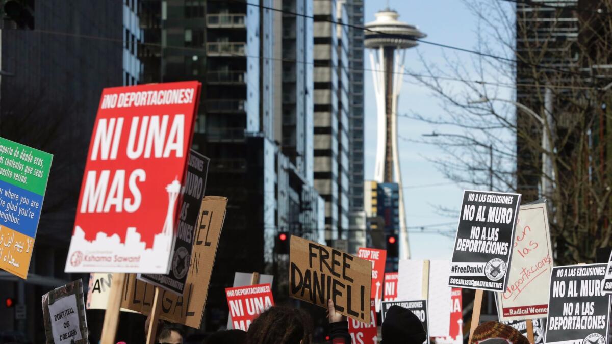 People march in Seattle to protest the detention of Daniel Ramirez Medina by immigration officials.