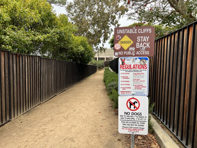 A sign at the Ho Chi Minh trailhead lists city of San Diego regulations for use of the property.