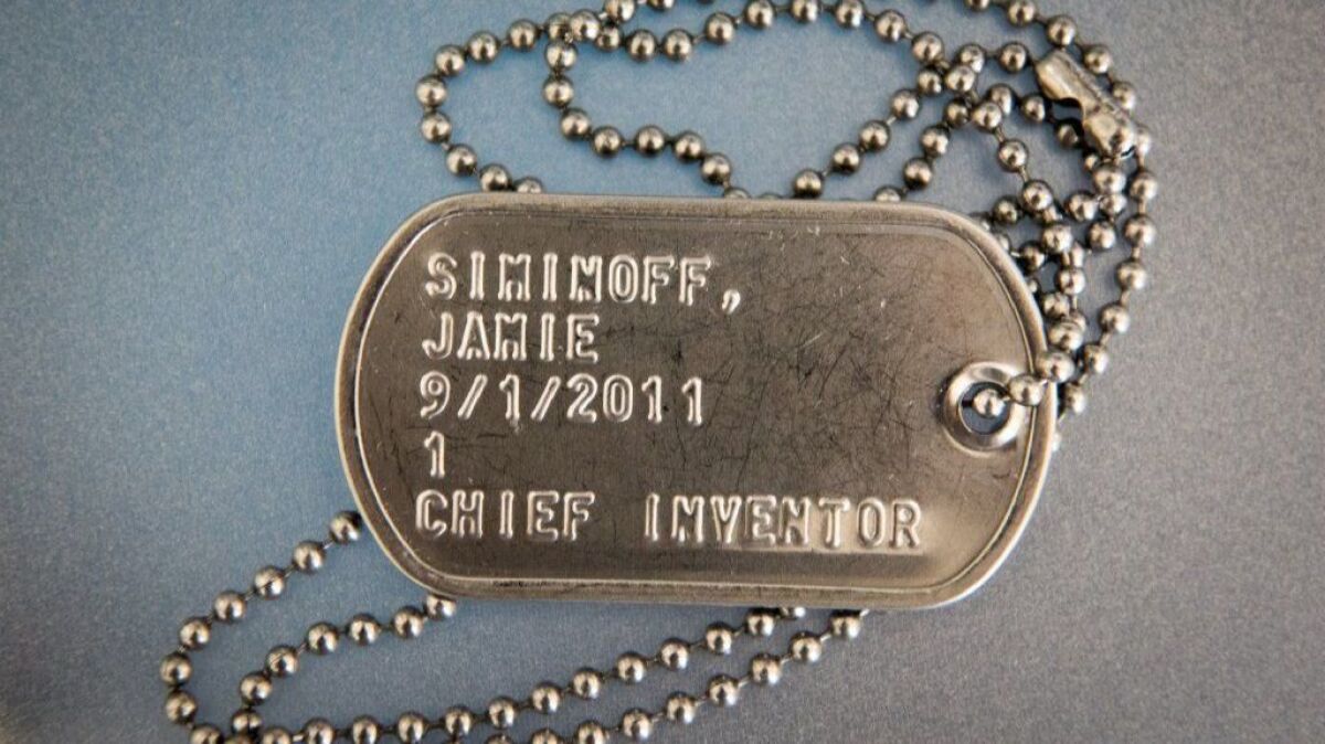 Siminoff treats employees as confidants in war, bestowing them with dog-tag-style security badges inscribed with name, start date and title. (Michael Owen Baker / For The Times)