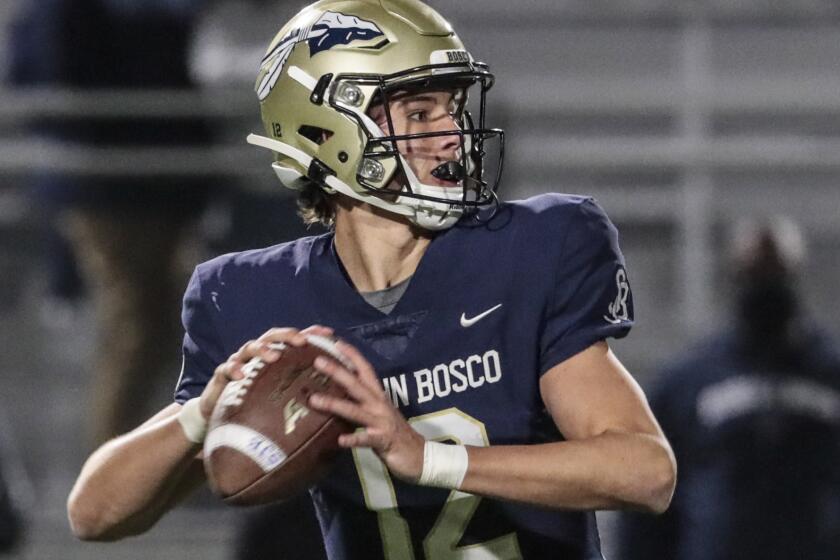 St. John Bosco quarterback Katin Houser drops back against Sierra Canyon on March 13, 2021.