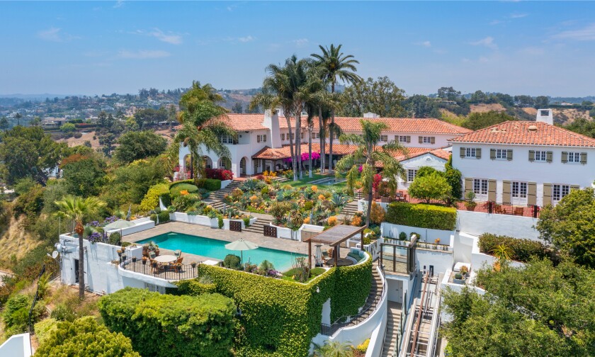 The 3-acre spread includes a 1920s main house, guesthouse, recording studio, movie theater and glass funicular.