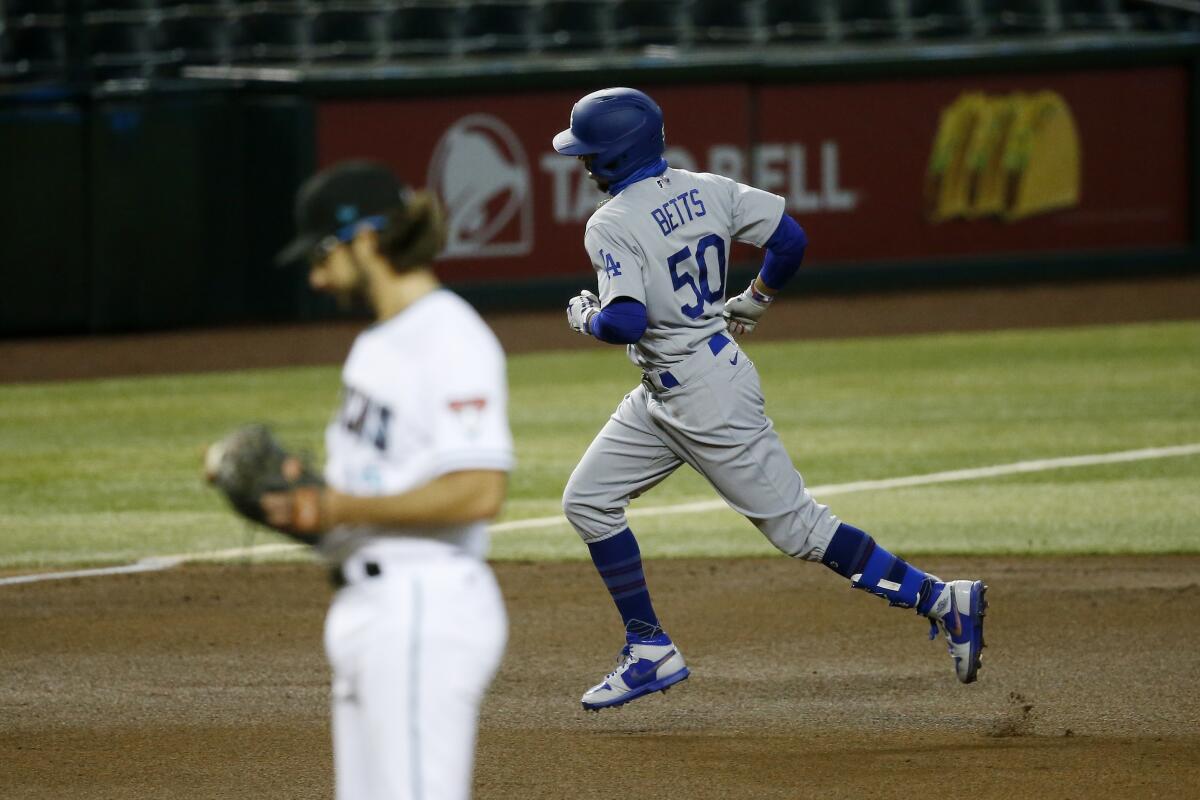 The Dodgers' Mookie Betts rounds the bases after hitting a home run against the Diamondbacks on July 31, 2020.
