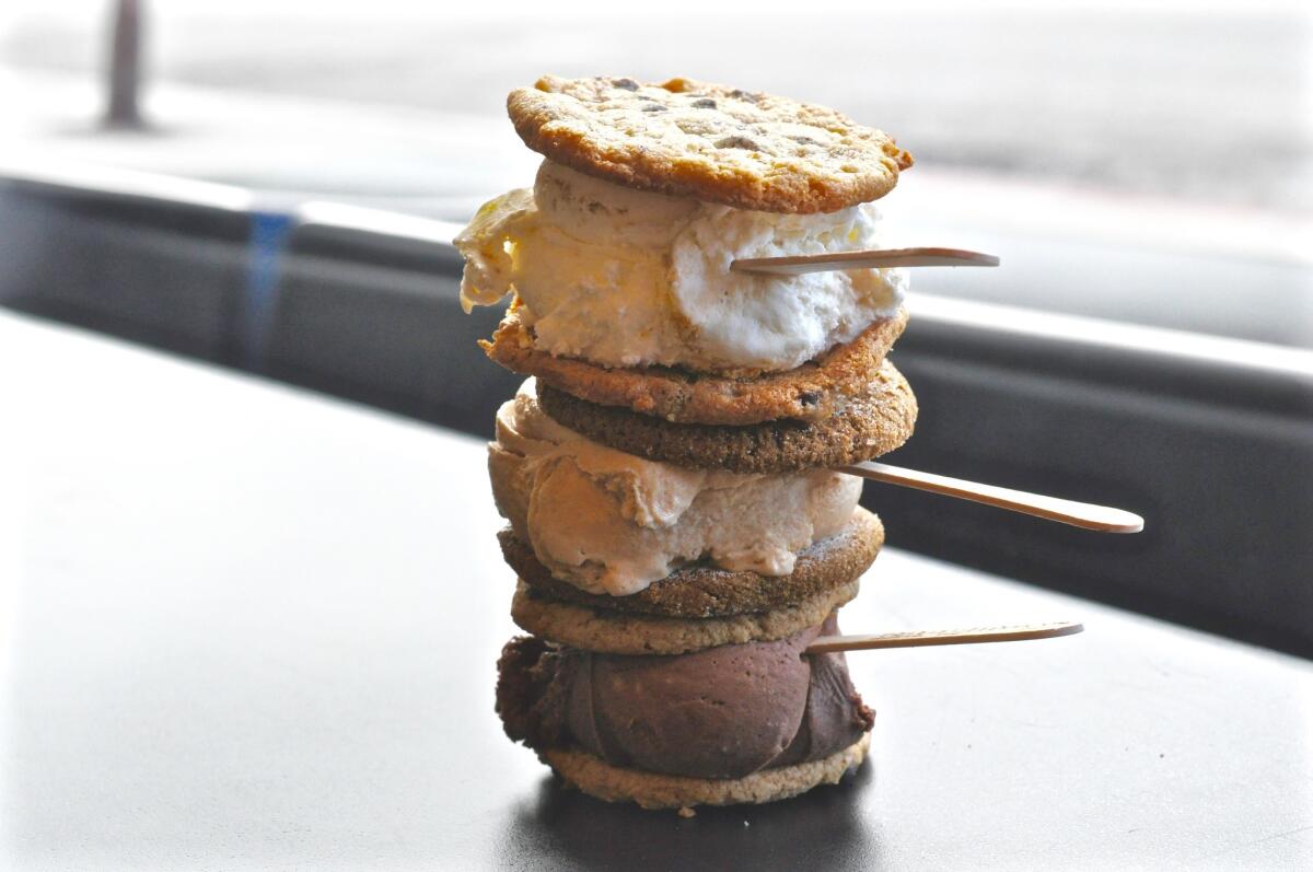 Three ice cream sandwiches — pick your flavor, pick your cookie — at Coolhaus in Culver City. (Amy Scattergood / Los Angeles Times)