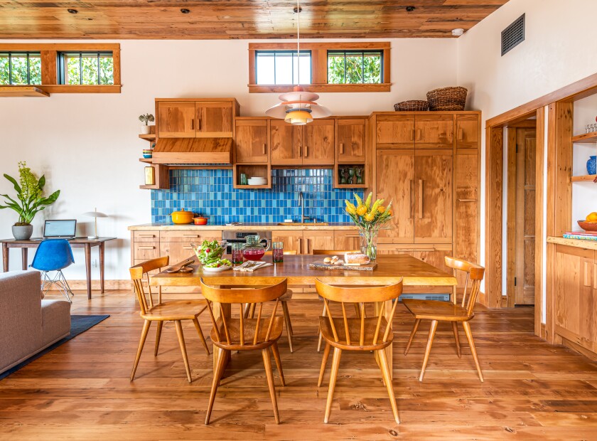 Wood cabinets, ceiling, floor and window trim in a kitchen/dining room