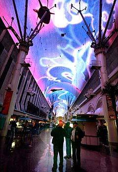 The Fremont Street Experience is a free light show projected onto the underside of a four-block-long metal canopy that arches over a pedestrian mall. Shows are at the top of the hour, from nightfall to midnight.