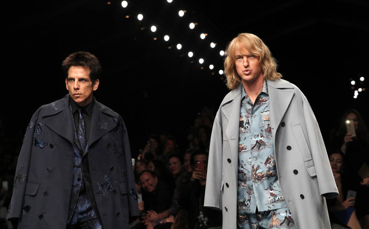 Actors Ben Stiller, left, and Owen Wilson wear creations for Valentino's fall-winter 2015-2016 ready-to-wear fashion collection presented at Paris fashion week.