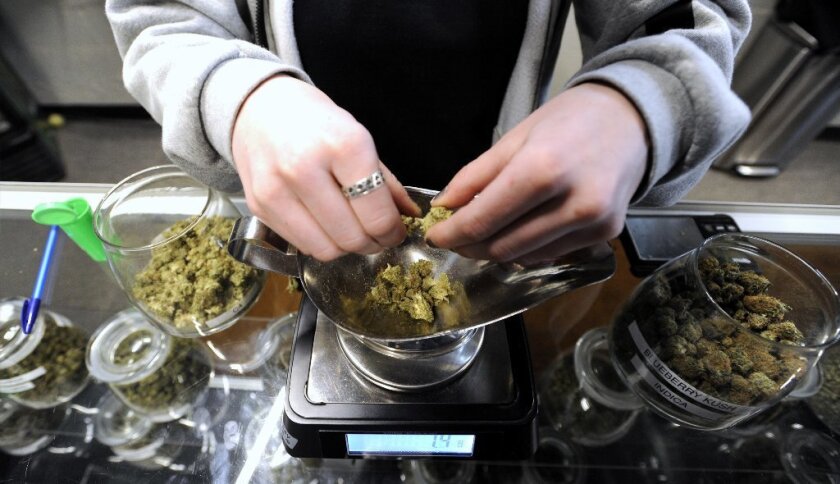 Marijuana is weighed at the Greener Crossing Medical Marijuana Care Giver Center in Detroit on March 9, 2017.
