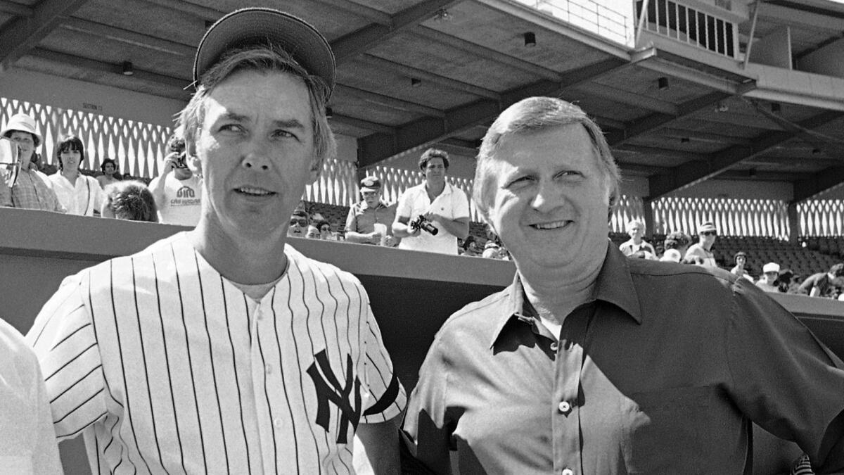 New York Yankees manager Gene Michael, left, and team owner George Steinbrenner chat at a team workout in Fort Lauderdale, Fla., on March 1, 1981.