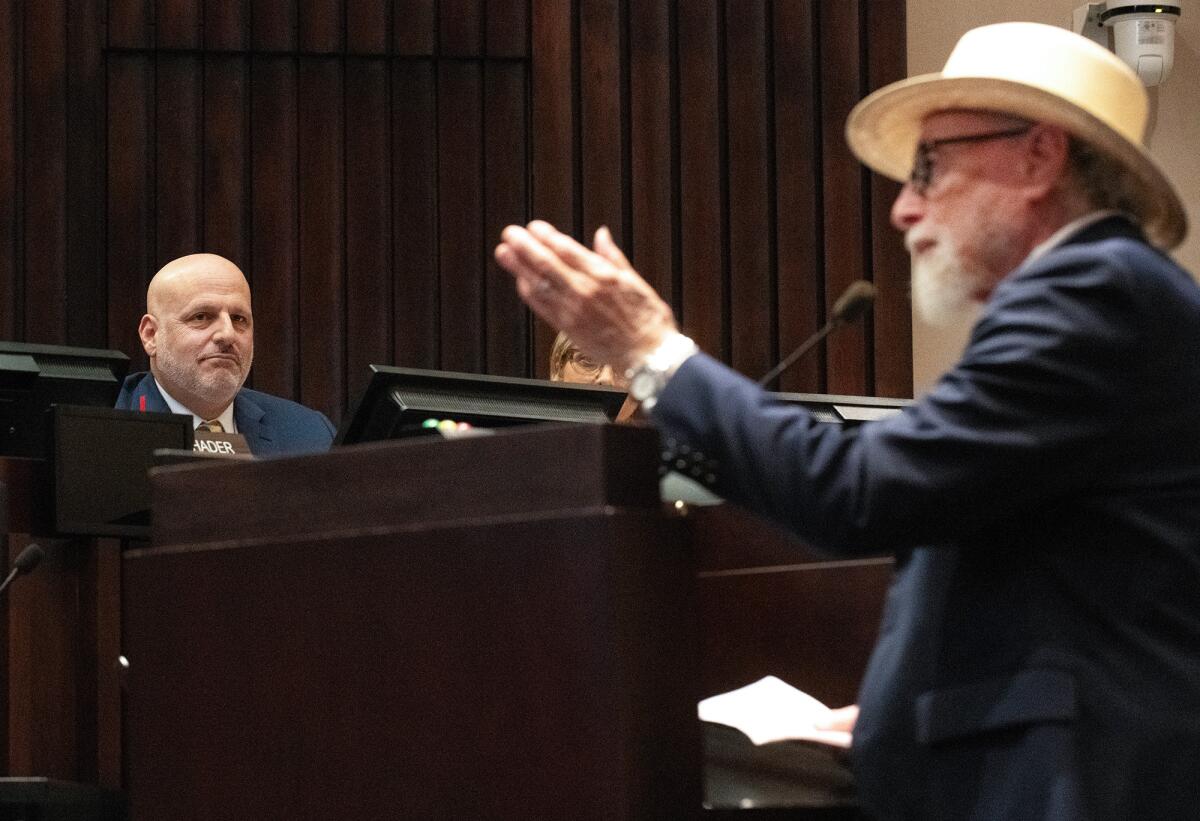 Orange County Human Relations Commissioner Rabbi Rick Steinberg, left, listens to public comment.