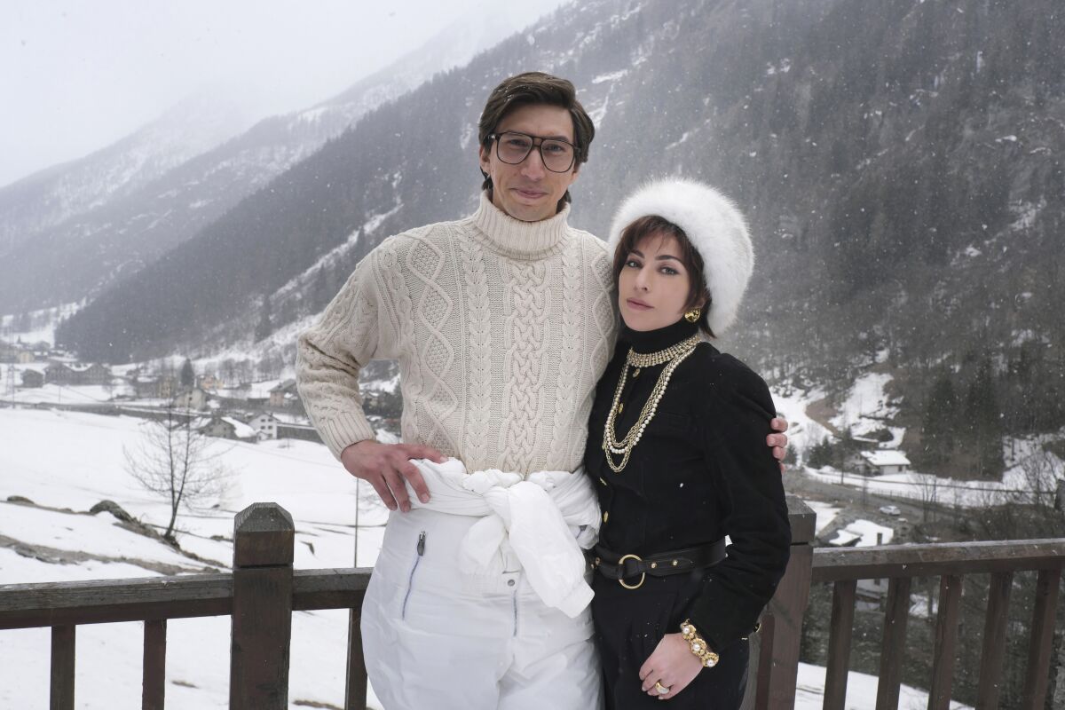 Adam Driver and Lady Gaga at a ski resort in a scene from "House of Gucci."