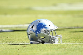 OAKLAND, CALIFORNIA - NOVEMBER 03: A Detroit Lions helmet lies on the field before.