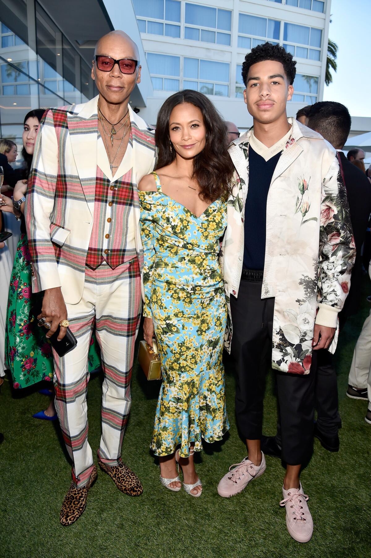 RuPaul, Thandie Newton and Marcus Scribner pose together at the tea party.