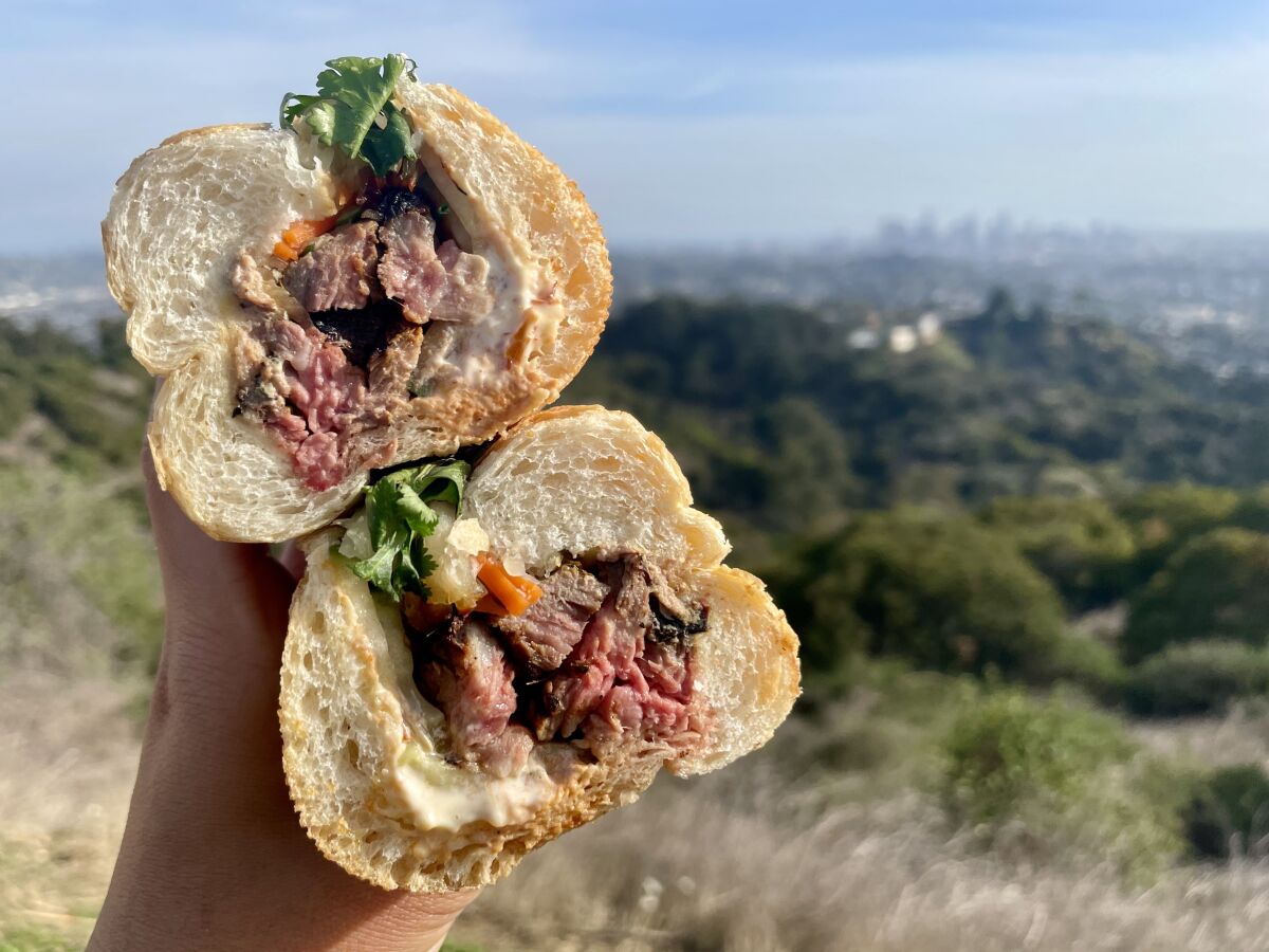 Gamboge in Lincoln Heights sells num pang - Khmer sandwiches on fluffy bolillo rolls, including this grilled lemongrass beef