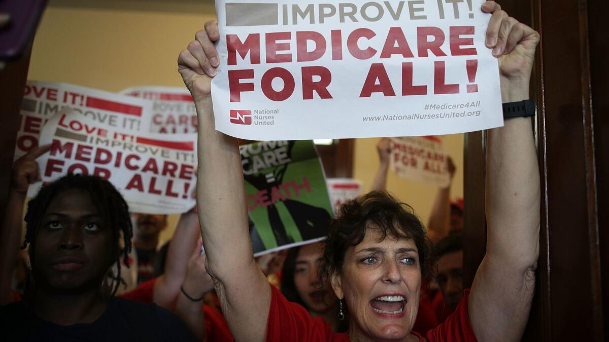 Activists protest against the Republicans' repeal-and-replace legislation in Washington on July 19, 2017.