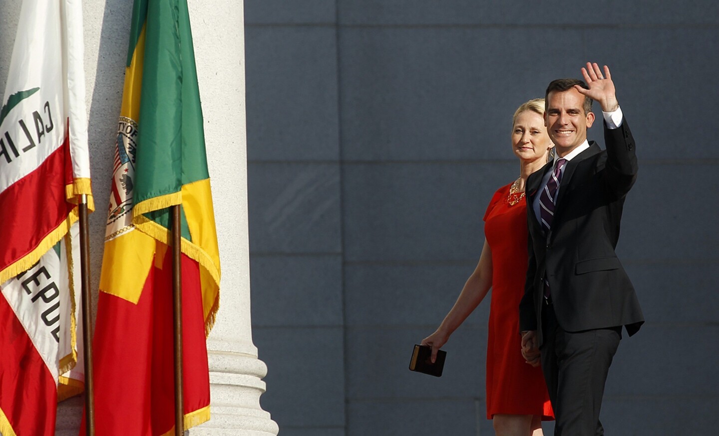 Mayor Eric Garcetti and his wife, Amy Wakeland, are introduced during his inauguration ceremony on the steps of City Hall in downtown Los Angeles.
