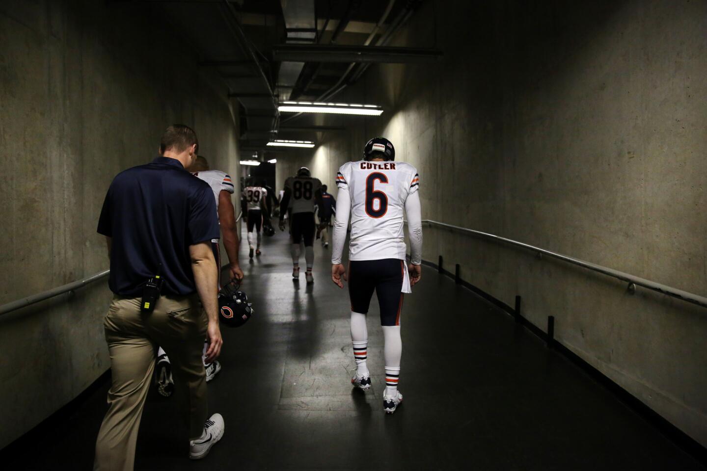 Jay Cutler walks to the locker room after the loss.