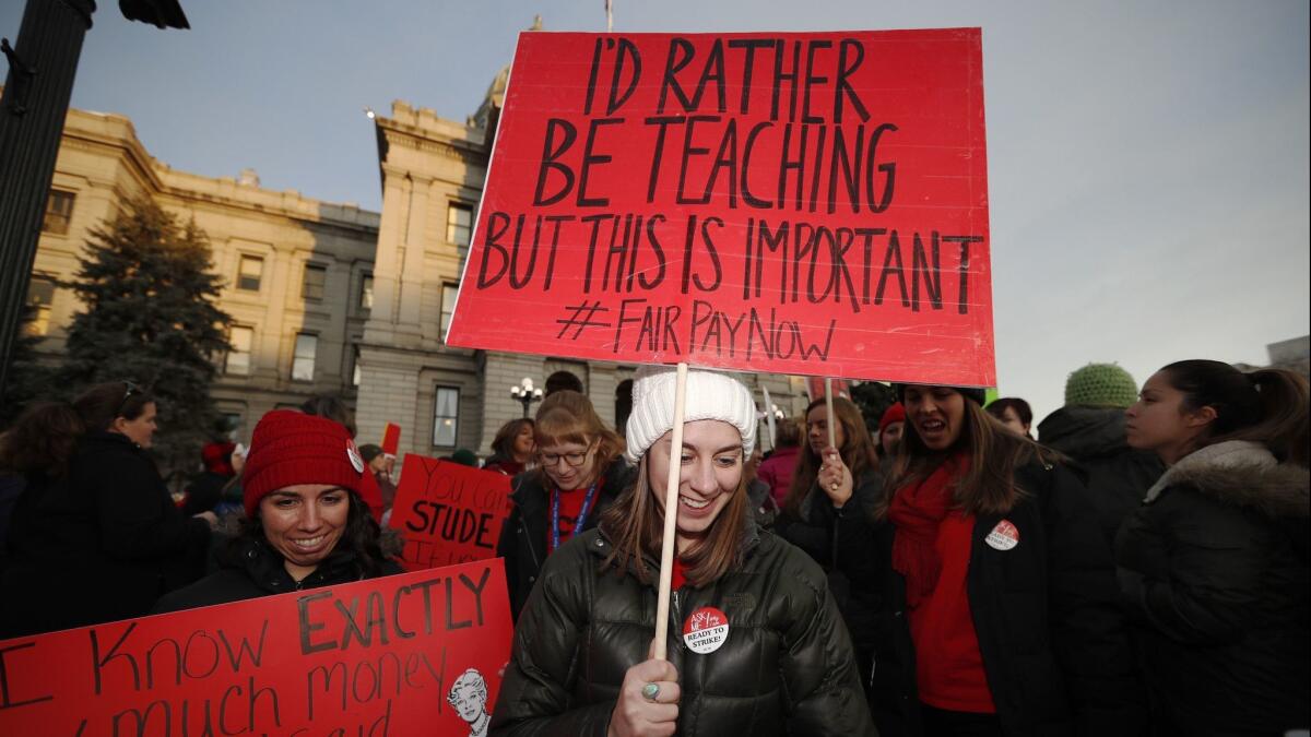 Margaret Flynn, a Denver Public Schools teacher, leads others in a march on Jan. 30.