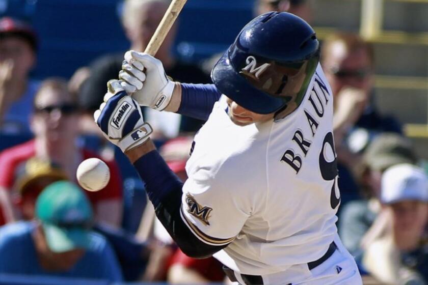 Brewers slugger Ryan Braun left the season opener against Colorado on Monday because of a muscle strain on his right side.