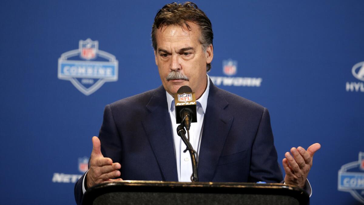 Rams Coach Jeff Fisher responds to a question during a news conference at the NFL combine last week.