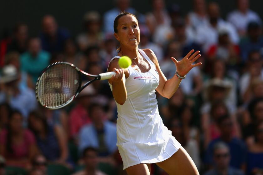 Jelena Jankovic hits a forehand against Petra Kvitova in a third-round match at Wimbledon on Saturday.