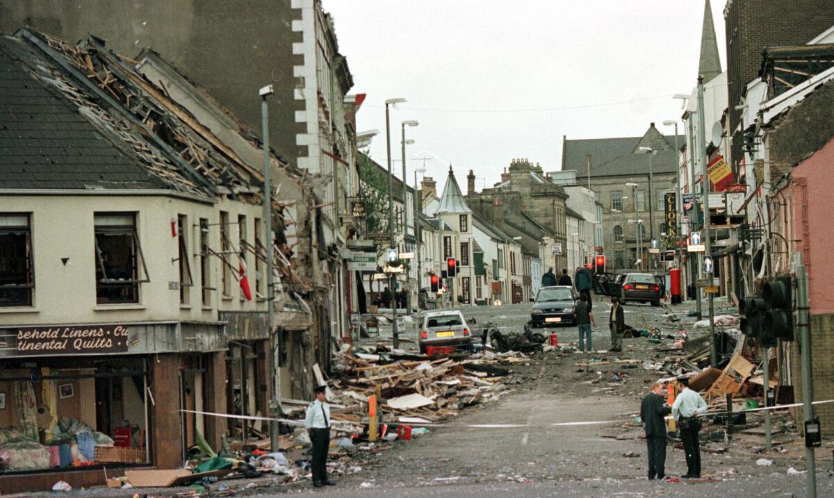 Officers stand on Market Street, the scene of a car bombing Aug. 15, 1998, in the center of Omagh in Northern Ireland.