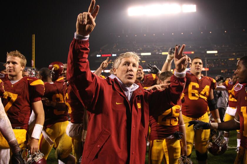 USC coach Pete Carroll celebrates after defeating the Boston College Eagles during the 2009 Emerald Bowl 